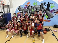 GP Gilas Boys after their basketball game, posed all together in red jerseys